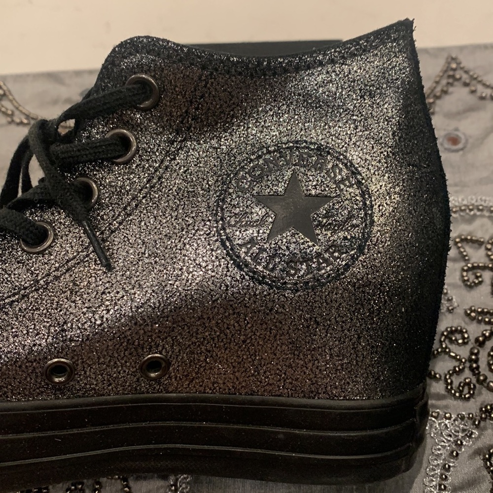 Converse women’s wedge sneakers in a metallic pewter and black finish